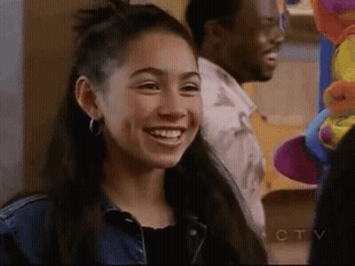 Young Woman Smiling Next To Man GIF