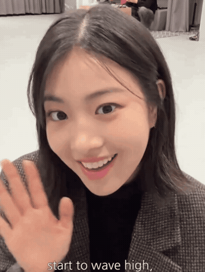 Young Woman Smiling Waving Start To Wave High GIF