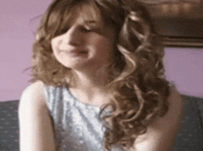 Young Woman Smiling With Eyes Closed GIF