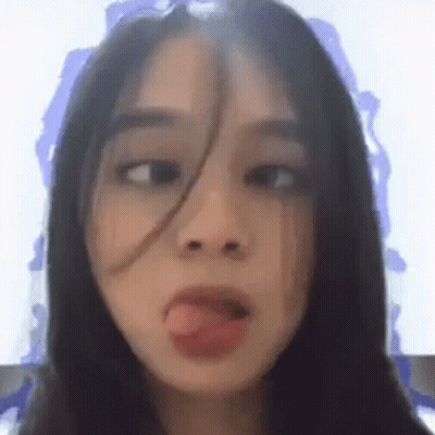 Young Woman Sticking Tongue Out GIF