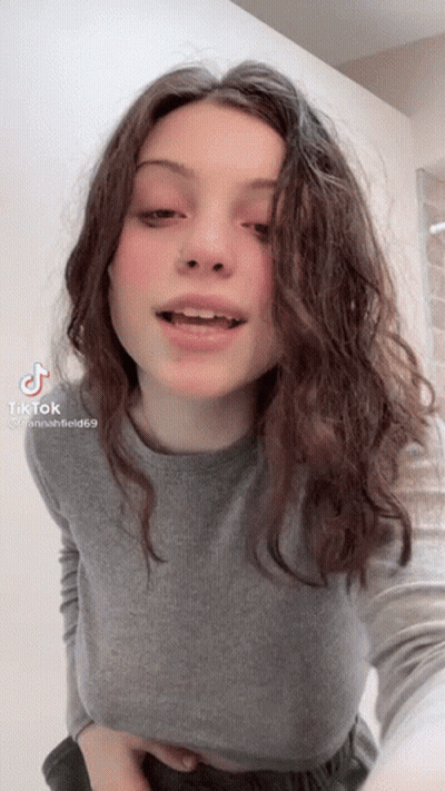 Young Woman Taking Selfie With Mouth Open GIF
