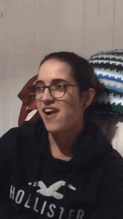 Young Woman Wearing Glasses And Hollister Sweatshirt GIF
