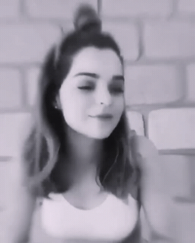 Young Woman With Bun In Black And White GIF