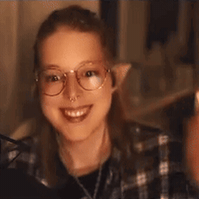 Young Woman With Glasses And Nose Ring Smiling GIF