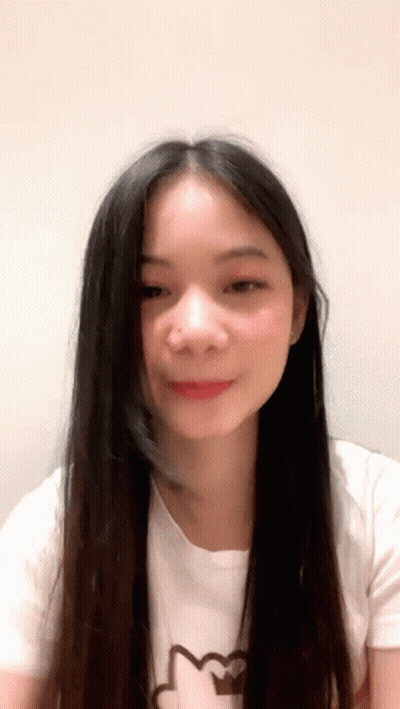 Young Woman With Long Black Hair In Cat Shirt GIF
