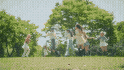 Young Women Dancing In Park GIF