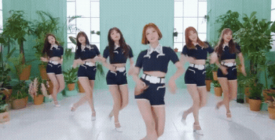 Young Women Dancing In Room With Plants GIF