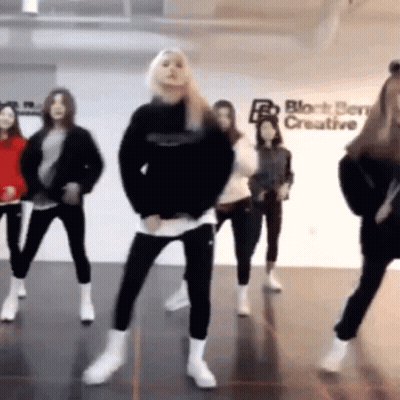 Young Women Dancing With Block Service Creative Sign GIF