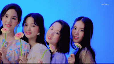 Young Women Holding Flowers GIF