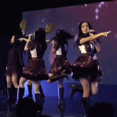 Young Women Holding Pom Poms On Stage GIF