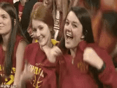 Young Women In Red Shirts Cheering In Stadium GIF