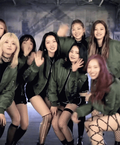 Young Women Posing One In Green Jacket GIF