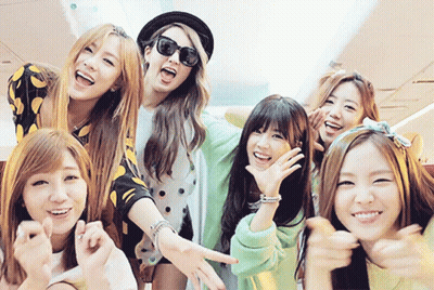 Young Women Posing One Wearing Sunglasses GIF