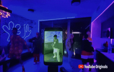 YouTube Music Ad People Dancing Blue Lights GIF