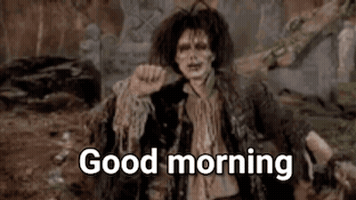 Zombie Saying Good Morning Sitting On Rock GIF