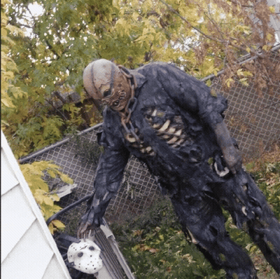 Zombie Statue Holding Hockey Mask GIF